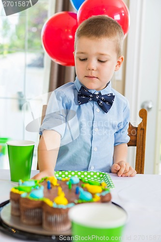 Image of Boy Eating Birthday Cake