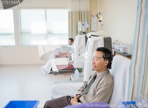 Image of Man Waiting For Renal Dialysis Treatment In Hospital