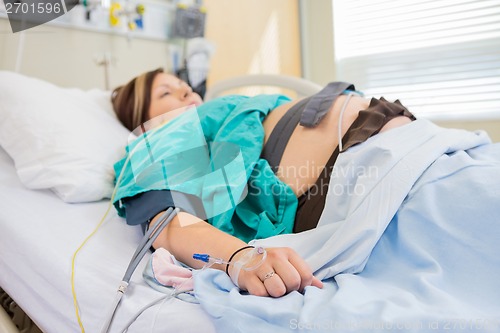 Image of Pregnant Woman With IV and Epidural