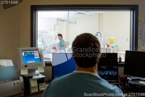 Image of Radiologist In CT Scan Lab