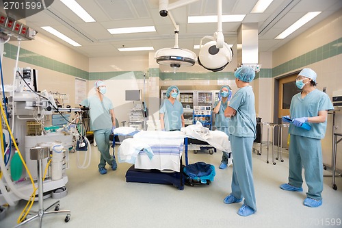 Image of Medical Team Discussing In Operation Room