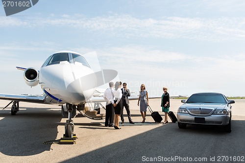 Image of Business People With Pilot And Airhostess At Terminal