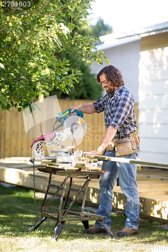 Image of Carpenter using Table Saw