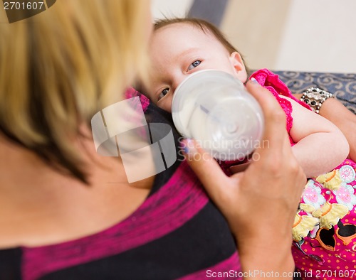 Image of Mother Feeding Milk To Newborn Baby Girl