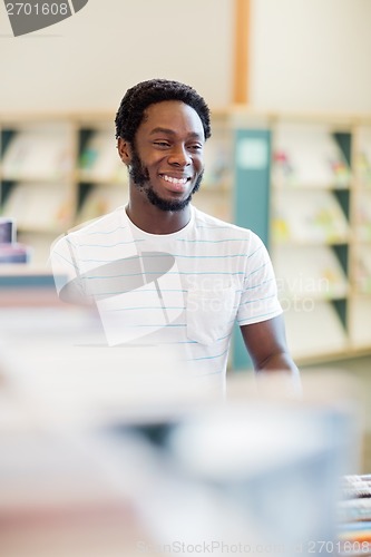 Image of Librarian Looking Away In Library