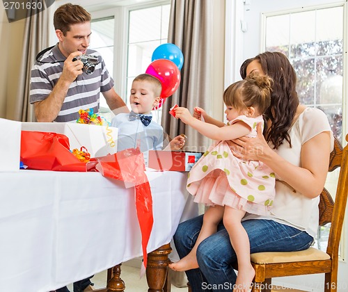 Image of Family Opening Birthday Presents
