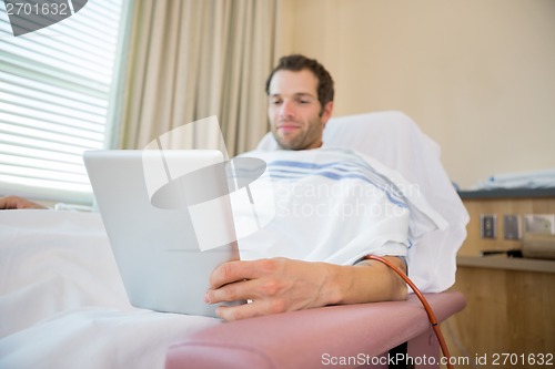 Image of Patient Using Tablet Computer During Renal Dialysis