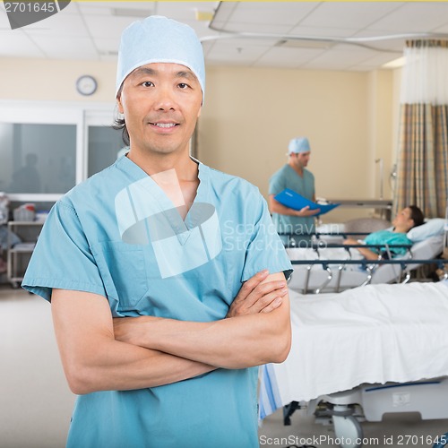 Image of Male Nurse Standing In Hospital Ward