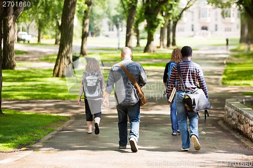 Image of University Students Walking On Campus Road