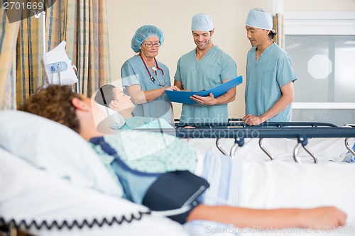 Image of Nurses Examining Patient's Report