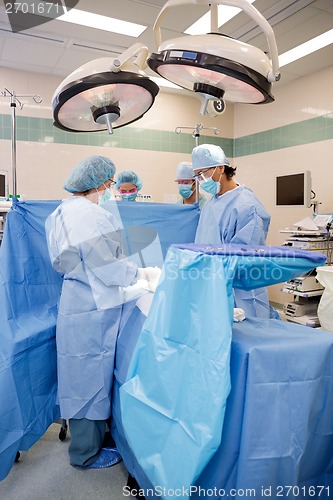 Image of Doctors Operating on Patient