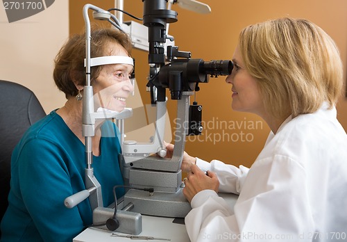 Image of Eye Doctor Examining Woman's Vision