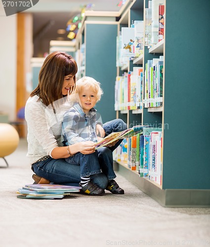 Image of Student With Teacher Reading Book In Library