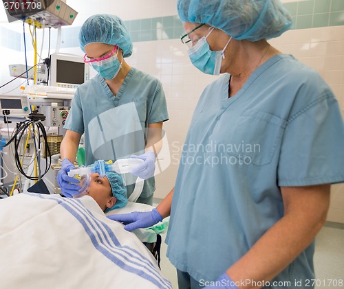 Image of Nurses Preparing Patient Before Operation