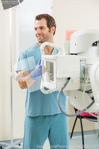 Image of Nurse Adjusting Xray Machine