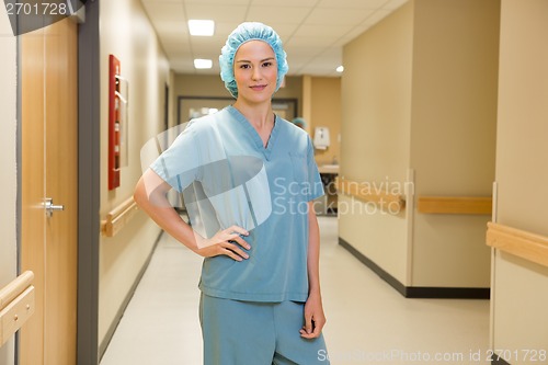 Image of Doctor With Hand On Hip In Hospital Corridor