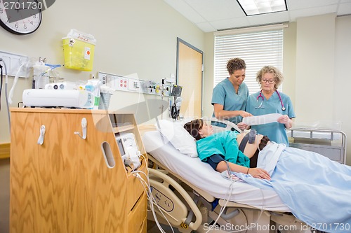 Image of Nurses Looking at Cardiotocograph Report