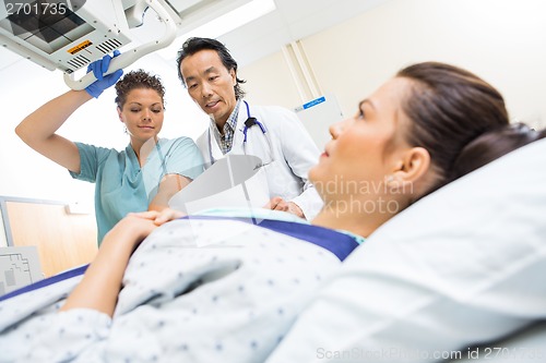 Image of Medical Team Preparing Patient For Xray