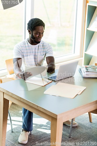 Image of Student Using Studying In Library