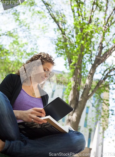 Image of Student Using Digital Tablet While Studying