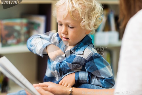 Image of Boy With Teacher Reading Book