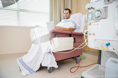 Image of Patient Holding Digital Tablet