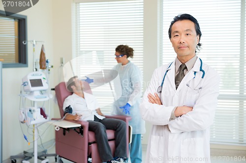 Image of Doctor With Patient Being Examined By Pulse Rate Machine