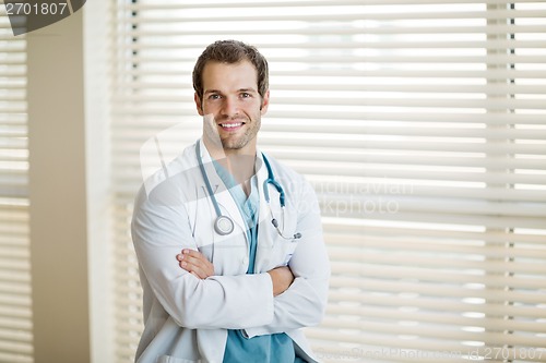 Image of Confident Cancer Specialist With Arms Crossed At Clinic