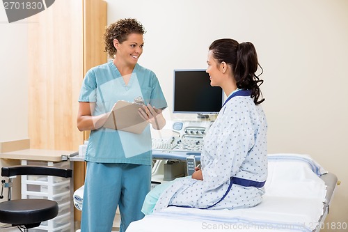 Image of Nurse Looking At Patient Before Ultrasound Test