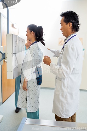 Image of Doctor Preparing Patient For Chest Xray