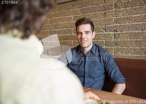 Image of Handsome Man Sitting In Coffee Shop