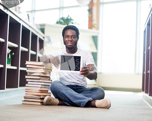 Image of Student With Books Showing Digital Tablet In Library