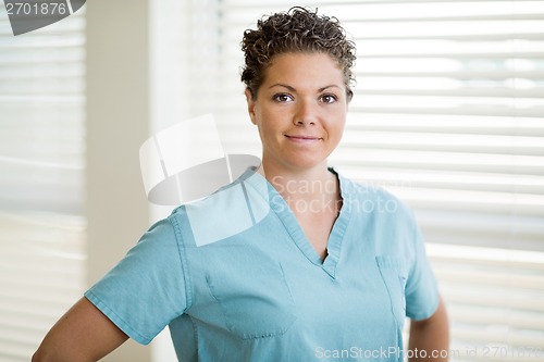 Image of Beautiful Female Nurse In Scrubs