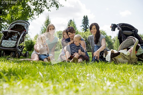 Image of Women With Their Children Enjoying Picnic