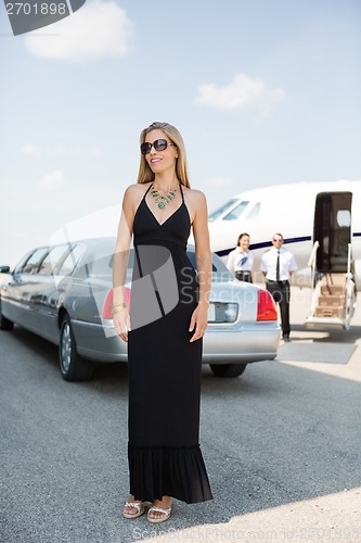 Image of Woman In Elegant Dress At Airport Terminal