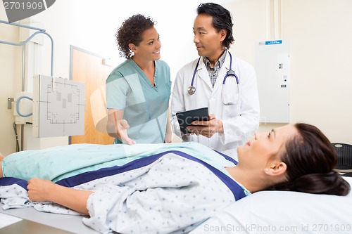 Image of Medical Team And Patient In Hospital Room