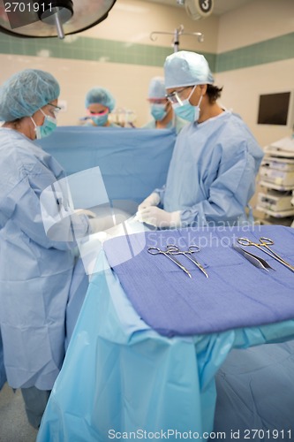 Image of Surgeons Operating in Surgical Theater