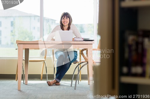 Image of University Student With Laptop In Library