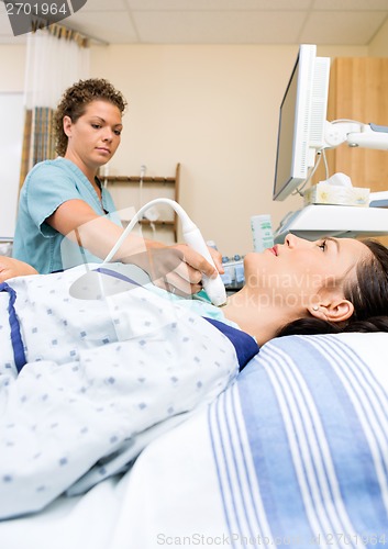 Image of Nurse Performing Ultrasound Neck Scan