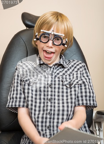 Image of Boy With Trial Frame Making Funny Face At Optician