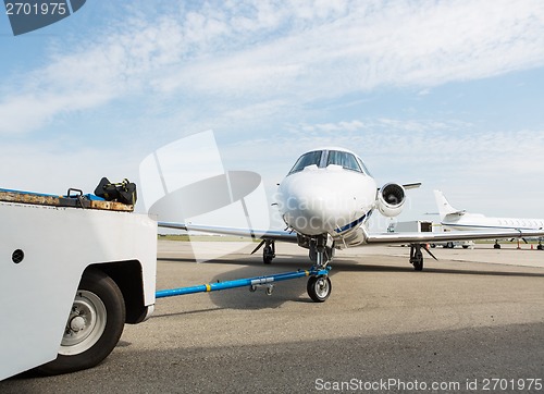 Image of Private Jet Towed By Ground Crew