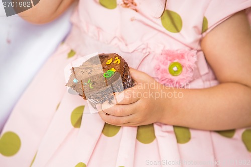 Image of Birthday Girl Holding Cupcake