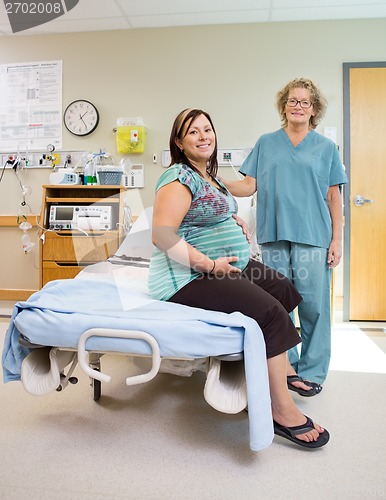 Image of Happy Nurse With Pregnant Woman In Hospital Room