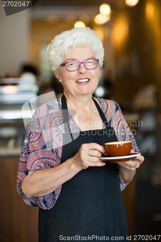 Image of Happy Waitress With Coffee Cup In Cafeteria