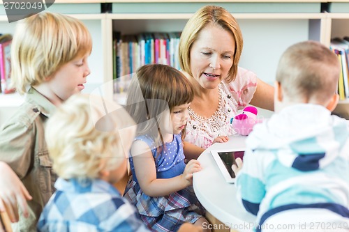 Image of School Children With Teacher Using Digital Tablet