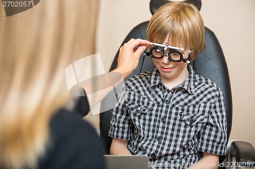 Image of Optician Determining Prescription Values With Trial Frame For Bo