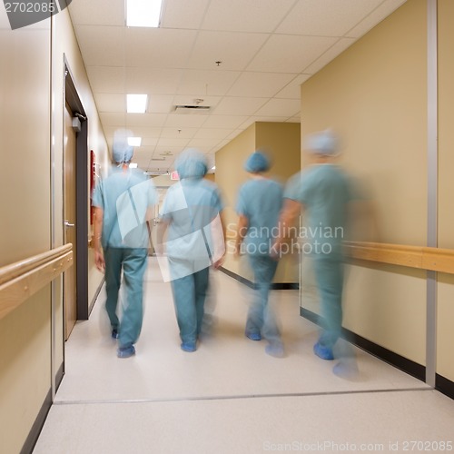 Image of Medical Team Walking In Hospital Corridor