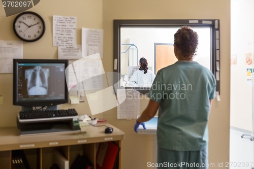 Image of Nurse Operating Machine In Xray Room