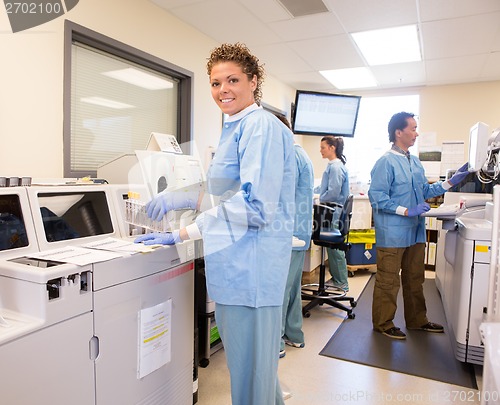 Image of Lab Tech using backup Chemistry Analyzer