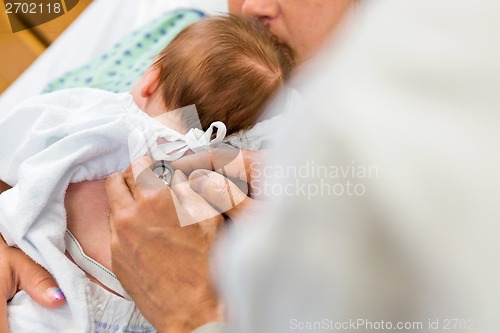 Image of Doctor's Hands Examining Babygirl With Stethoscope